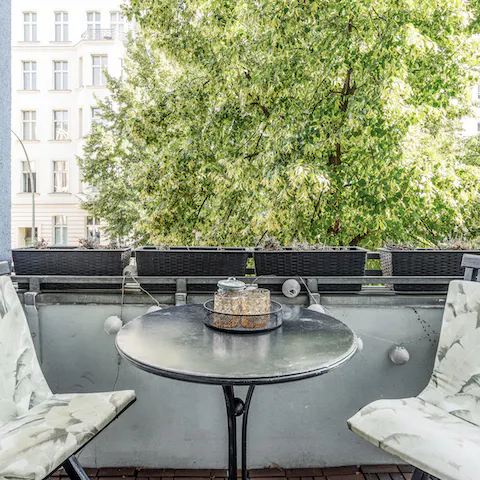 Spend your mornings on the private balcony with a coffee and pastry 
