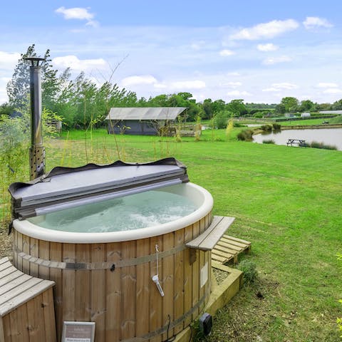 Sink into the hot waters of your private, wood-fired hot tub