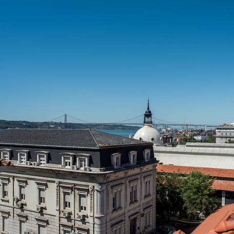 Take in the views over the rooftops to the River Tagus