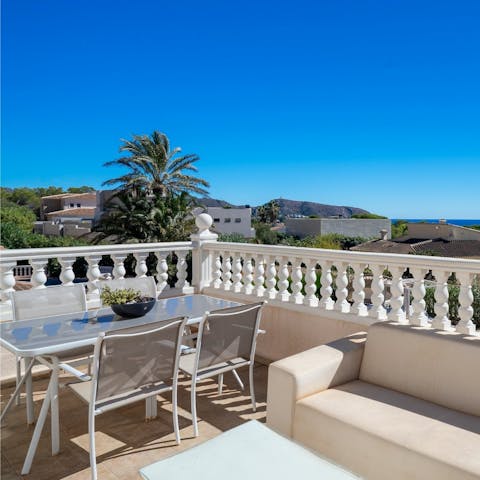 Take in the spectacular views of the mountains and ocean in the distance from your balcony