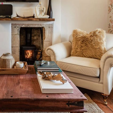 Gather around and cosy up by the wood burning stove