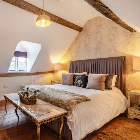 Fall asleep under the traditional wooden beams in the beautiful bedroom