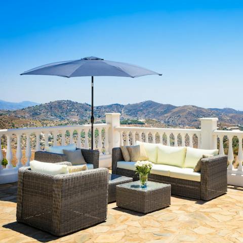 Enjoy the chill-out area overlooking the hills of Sierras de Tejeda