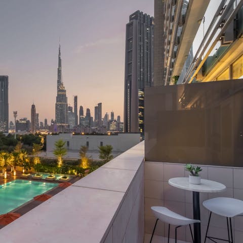 Marvel at the breathtaking views of the Burj Khalifa from your private balcony 