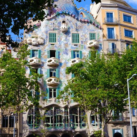 Visit Casa Batlló, a Gaudi masterpiece building, just a twenty-minute walk away
