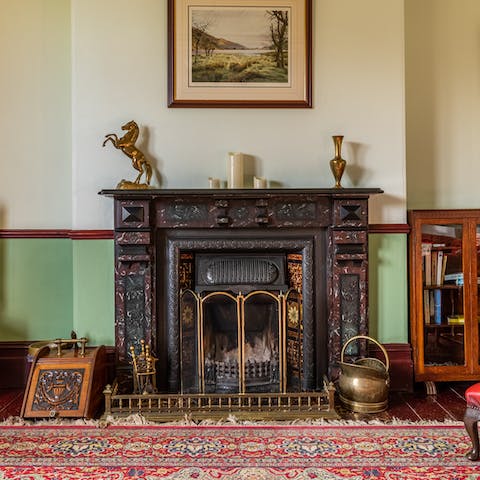 Get a fire crackling in the beautiful Victorian fireplace