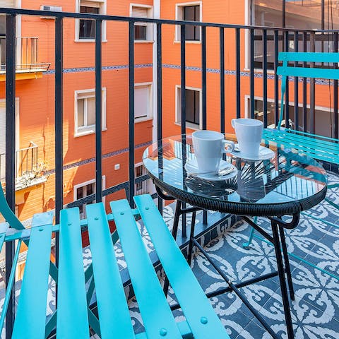 Start your day with a cup of coffee out on your private balcony 