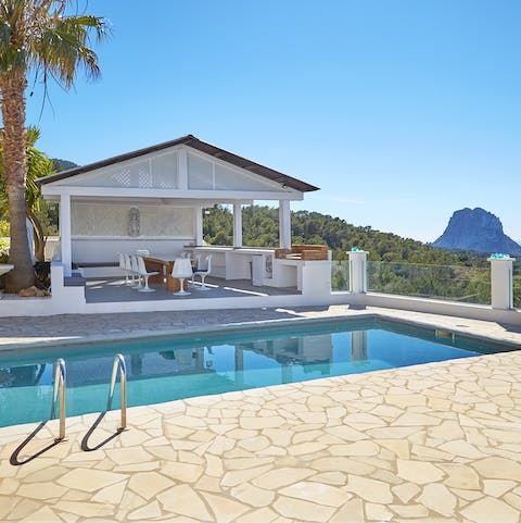 Go for a dip in the private pool, with stunning views of Es Vedrà