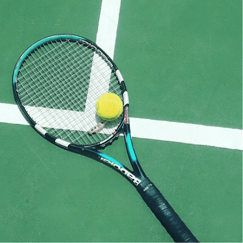 Take on the challenge at the communal tennis court
