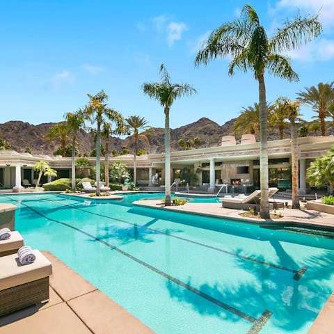 Swim lengths in the huge pool with mountain views