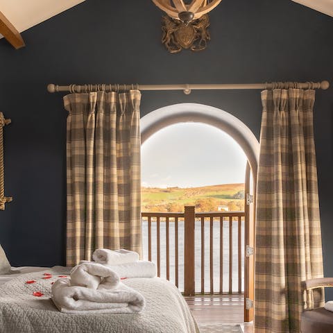 Wake up to striking views of the lake from the master bedroom