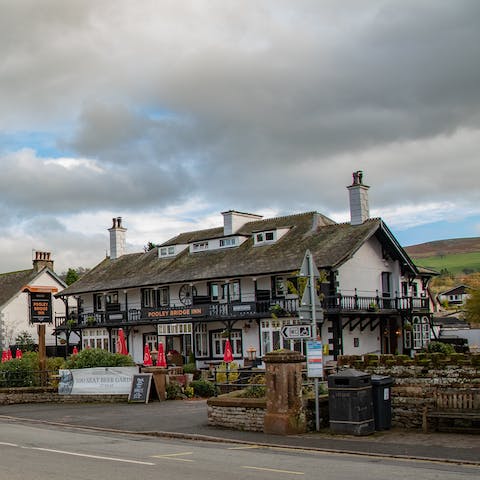 Take a fourteen-minute stroll to the charming village of Pooley Bridge, where you can enjoy a pint of ale by the waterside