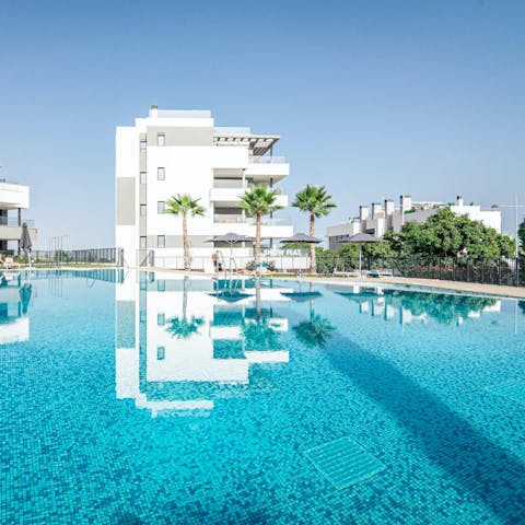 Go for a dip in the large heated communal swimming pool