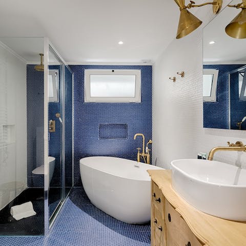 Treat yourself to an indulgent soak in the sleek freestanding tub