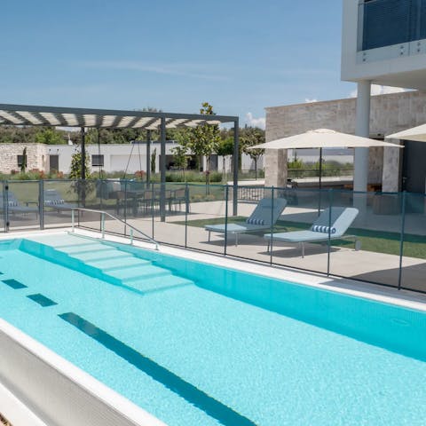 Relax and savour blissful days by the swimming pool