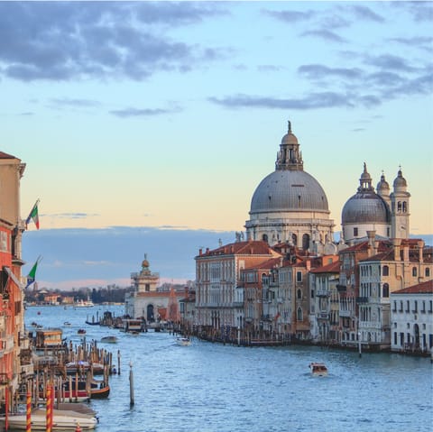 Take an evening walk to view the sunset over Venice from Accademia Bridge 