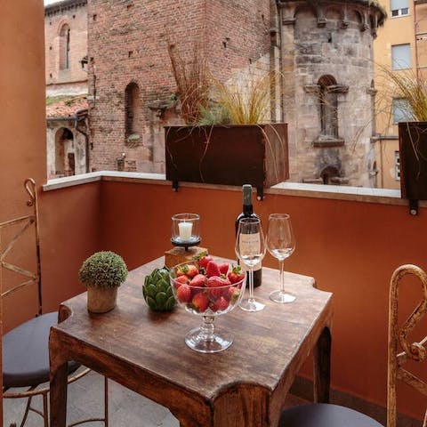 Pour a glass of wine or savour a couple of negronis on the private balcony