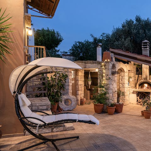 Relax and enjoy warm summer evenings in the backyard 
