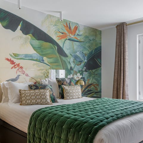 Admire the colourful, tropical mural on your bedroom wall