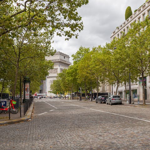 Peek around the corner at the Arc de Triomphe, just over a five-minute walk away