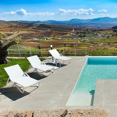 Relax on the sun beds with the sprawling countryside as your view 