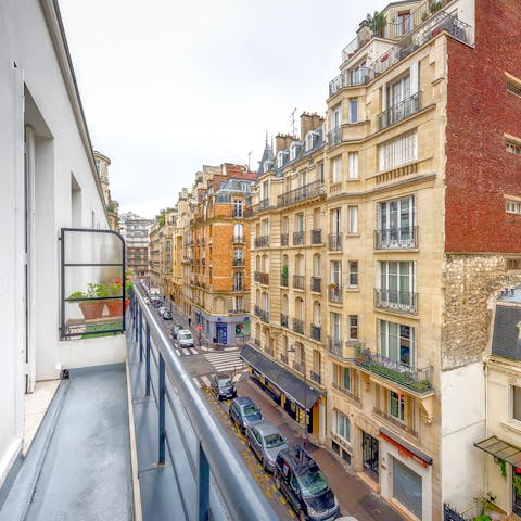 Step out onto the slender balcony and admire your typically Parisian street