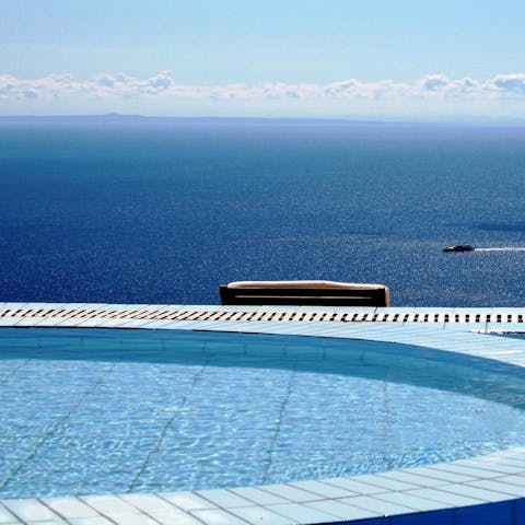 Soak in the hot tub as you admire the sea view