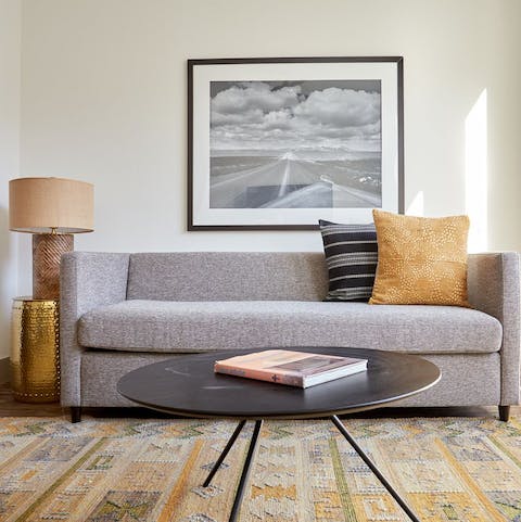 Kick back in the bright living room with a cold beer after a day of Austin sightseeing