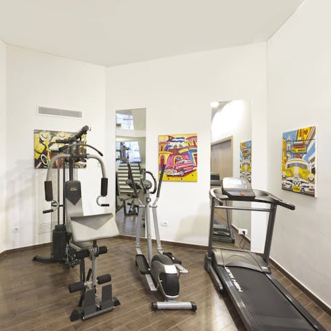 Keep on top of your fitness regime in the home's gym surrounded by artwork