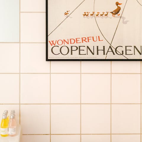 Wash up in a charming metro-tiled bathroom with cute prints