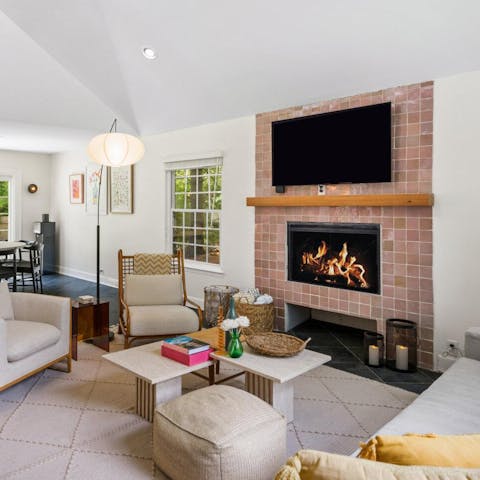 Snuggle around the fireplace when staying during the chillier months