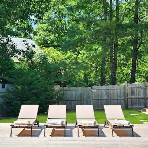 Soak up some Hamptons sunshine from the poolside loungers 