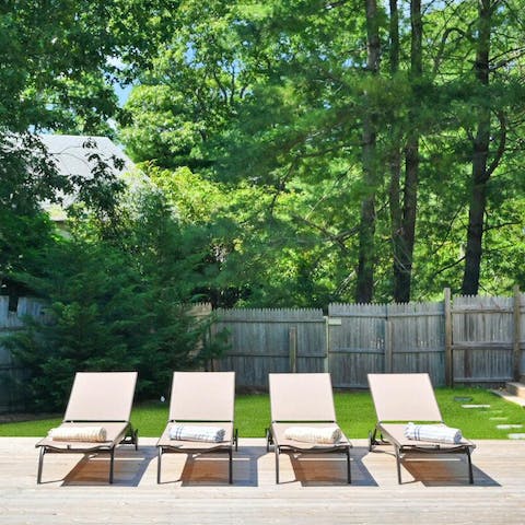 Soak up some Hamptons sunshine from the poolside loungers