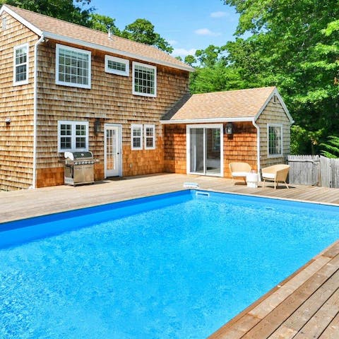 Swim gentle laps in the private swimming pool 