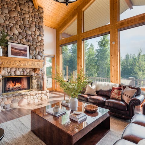 Share stories around the fireplace, against the mountainous backdrop
