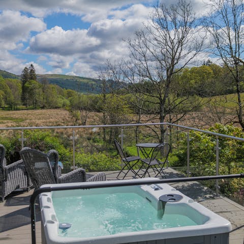 Relax in the warming bubbles of the hot tub as you soak up the view