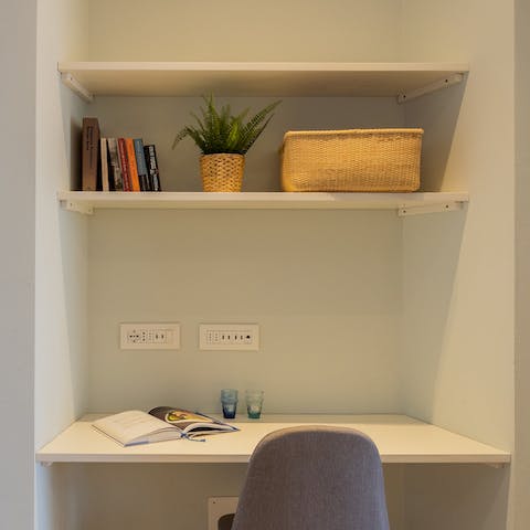 Get some work done at the desk tucked into the wall-press