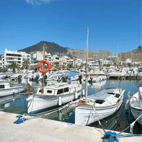 Soak up the sunshine and swim in the sea in Port de Pollença, a short drive or fifteen-minute walk away