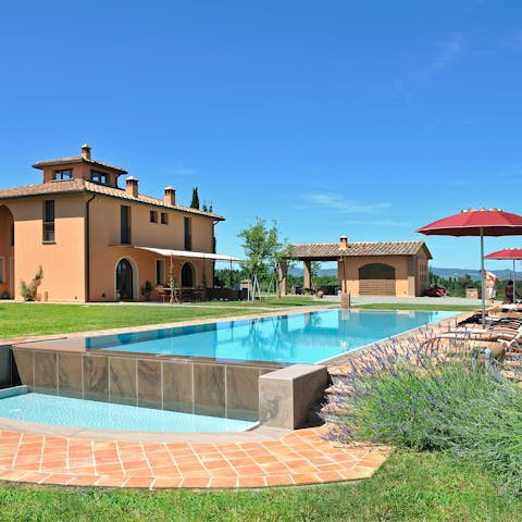 Enjoy the Tuscan sun with a dip in the private outdoor pool