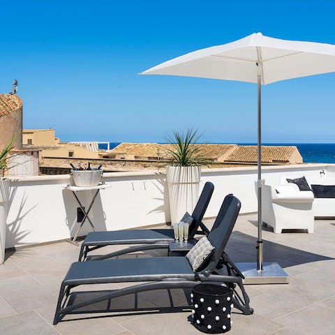 Soak up the Sicilian sunshine on the rooftop terrace 