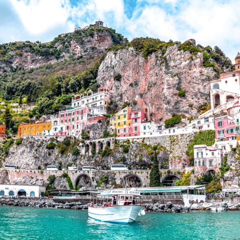 Explore the pastel coloured buildings and rugged shoreline of the Amalfi Coast