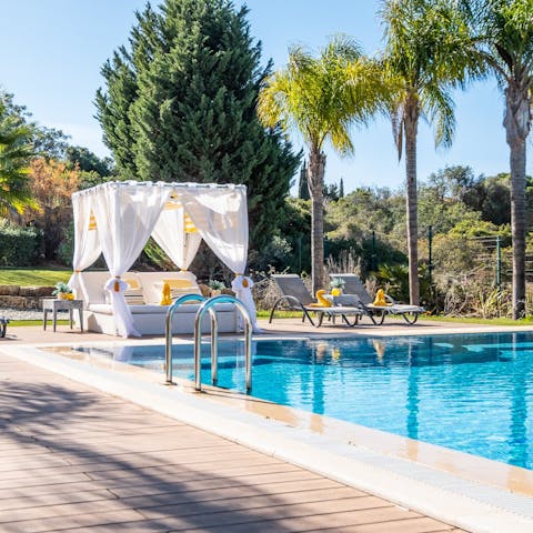 Cool off in the pool or soak up the sun on the sun loungers and day bed