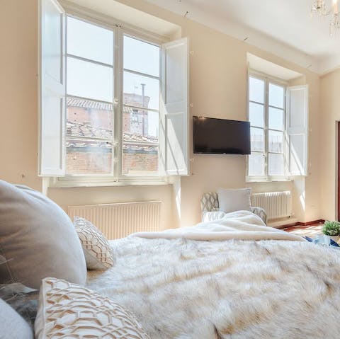 Wake up to views of Lucca through the large sash windows