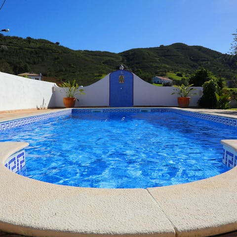 Splash about in the villa's very own swimming pool surrounded by rural scenery