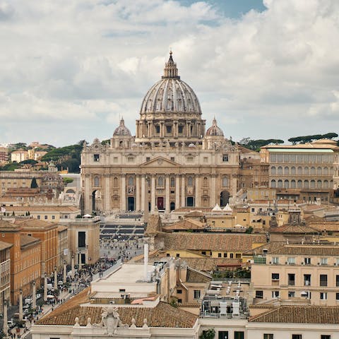 Visit St Peter's Square in Vatican City, a thirty-minute walk away