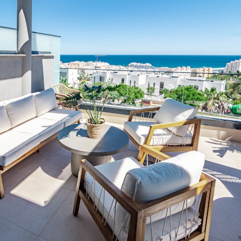 Sink into the balcony sofas for some downtime with your holiday read and a view