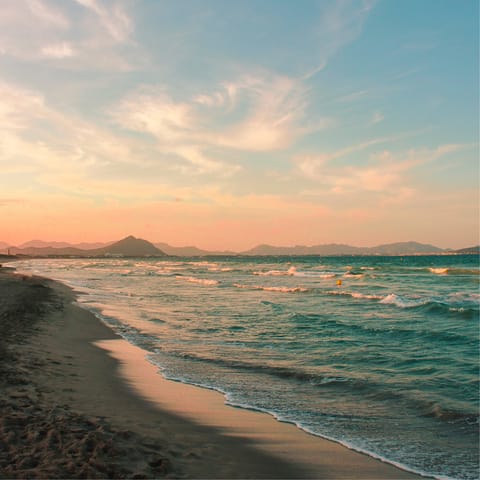 Stroll along the golden sands of Playa Beach at sunset, it's 1km away
