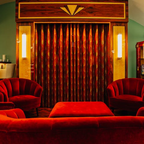 Curl up in front of a movie in the Art Deco entertainment room