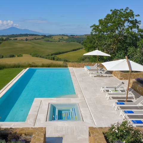 Laze by the pool or soak in the Jacuzzi and admire the views