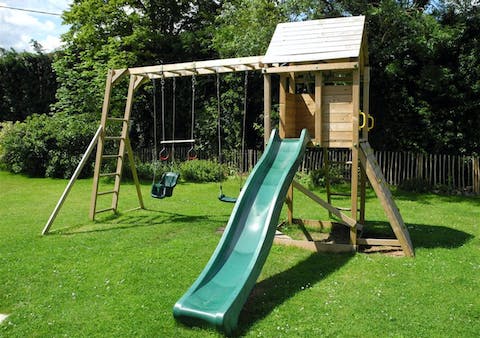 Enjoy playtime with the kids on the climbing frame and swing set